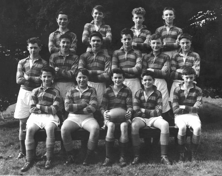 Scan1839_4.jpg - Rugby team with Peter Barry, 1958-59 This is the second year team for 58-59 which was calledthe Fourth XV at that time. The names are from Back Left: Charlie Duthie; Tony Kelly; John Colvin; James Welsh,Brian Sadler; John Kelly; Chris Barlow;  Tim Sheehan;  Stan Sinclair; Hugh Wray; Joe Flaherty; Stephen Pstrowski; John Lehaney;  Ronnie Rolli; Peter Barry