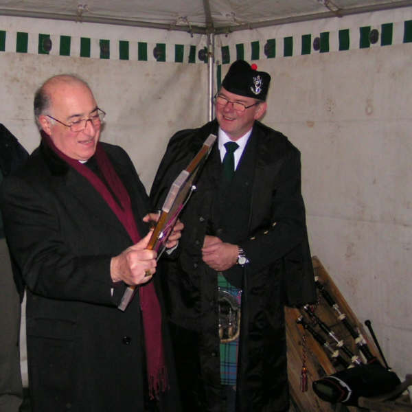 Delighted.jpg - Donald Shaw "I have written a new tune, a 2/4 march called 'Archbishop Mario Conti's Welcome to Eskadale'.  The Archbishop of Glasgow was up in our neck of the woods last Saturday night and said mass at St Mary's Eskadale"  http://www.scalan.co.uk/Eskadale.htm   I had just written a tune which seemed to fit the bill.  The Archbishop was delighted and took away a signed framed copy of the tune which I had played for him. 