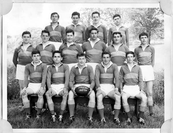 FirstXV-63-64.jpg - Fist XV 1963-64 Adrian McDonald,Ken O'Hara,Willie Parry, Lindsay WilsonJohn Cregan, Henry McLaughlin, Joe Tapper,Hubert Ross, John Bacigalupo,?Peter Slepokura, Ian Somerville,John Perrins(capt), Roddy Zentil,John Barry